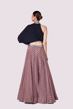 Keep it stylish on special occasions in this alluring black one shoulder-top with multicolor skirt. Shop online from Pure Elegance. Disclaimer: The actual product may vary slightly from the image. These are custom orders, hence expect slight variation in color and placement of the motif or buta. ESTIMATED DELIVERYBecause this is a custom order, it would take about 4 weeks from the date of purchase. RETURN POLICYThis product is a custom order and cannot be returned or exchanged. One Shoulder Fitted Party Lehenga, Asymmetrical Red Party Skirt, Red Asymmetrical Party Skirt, Red Asymmetrical Skirt For Party, Fitted One-shoulder Party Sets, Multicolor Long Skirt For Evening, Multicolor Party Sets With Long Skirt, Festive Black Skirt, Fitted Multicolor Skirt Set For Party