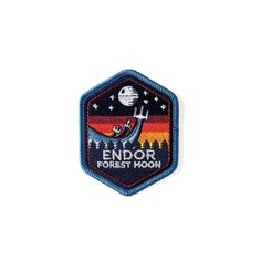 an embroidered patch with the words endor forest moon in front of a white background