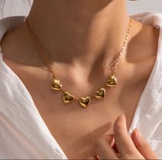 Introducing the exquisite Heart Pendant Necklace, a timeless piece designed to enhance any outfit with its delicate charm. Crafted with high-quality materials, this necklace features a series of elegant, gold-tone heart pendants that sit gracefully on a classic chain. Measuring 18 inches in length, it’s the perfect accessory for adding a touch of romance to your everyday look or special occasion attire. Features: • Length: 18 inches, ideal for a flattering, comfortable fit. • Design: Five polish Animal Sunglasses, Black Obsidian Stone, Wedding Types, Heart Shaped Pendant Necklace, Lovers Necklace, Stainless Steel Chain Necklace, Heart Pendants, Bohemian Handmade, Couple Necklaces