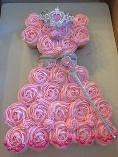 a princess dress made out of cupcakes with pink frosting