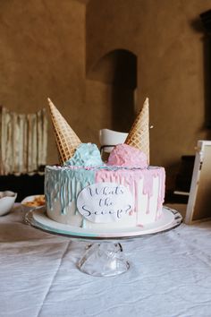 a cake with ice cream cones on top of it