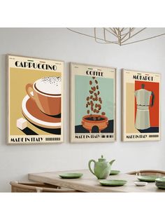 three vintage coffee posters on the wall above a dining room table with plates and cups