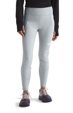 Made from the brand's FlashDry™ moisture-wicking fabric to keep you comfortable, these cozy leggings are fitted with large pockets to hold your essentials and a fitted design to seamlessly layer into your cold-weather hike or trail run look. 28" inseam Pull-on style Drop-in pockets; back waist zip pocket FlashDry™ moisture-wicking fabric stays cool and dry 73% recycled polyester, 27% elastane Machine wash, tumble dry Imported Cold Weather Hiking, Stirrup Leggings, Pocket Leggings, Moisture Wicking Fabric, Cold Weather, Moisture Wicking, North Face, The North Face, Womens Bottoms