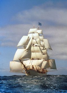 an old sailing ship in the middle of the ocean