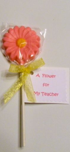 a flower for my teacher lollipop on a stick with a yellow ribbon around it