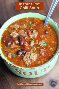 a bowl of instant pot chili soup with beans and meat in it on a wooden table