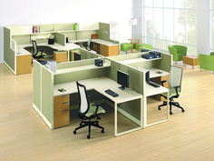 an office cubicle with desks and chairs