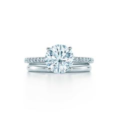 a white gold engagement ring with diamonds on it