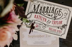 wedding stationery with flowers on wooden table