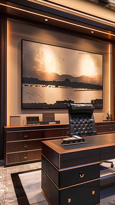 an office with a large painting on the wall and leather chair in front of it