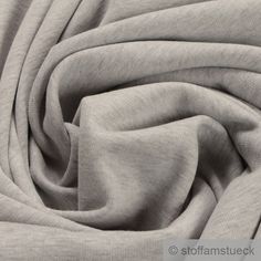 a close up shot of the fabric in light grey color, with very thin lines