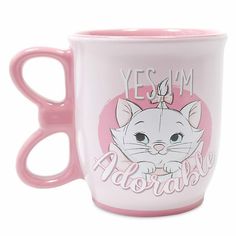 a pink coffee mug with an image of a cat on it