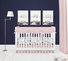 a baby's room with blue walls, pink curtains and a white crib