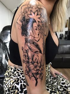 a woman with a tattoo on her arm