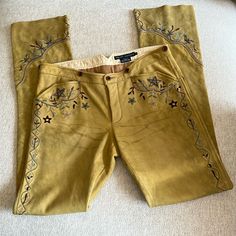 Rare Vintage Ralph Lauren Blue Label Embroidered Leather Pants! These Are Beautiful!!! Extremely Rare!! The Most Special Buttery Soft Pants! Excellent Condition! Button Front Closure & Adjustable Rear Waist Strap. So Sad These No Longer Fit Me. Yellowish/Beige/Tan Leather With Multicolored Floral And Star Embroidery!! Got So Many Compliments Every Time I Wore Them!! Easy To Dress Up Or Down! Marked Size 8 But Please Compare Measurements! Measurements Waist Across Flat:15.5” Front Rise: 8.5” Back Fitted Ralph Lauren Bottoms For Fall, Fitted Embroidered Trousers, Fall Embroidered Fitted Pants, Fitted Embroidered Straight Leg Pants, Traditional Fitted Brown Bottoms, Real 70s Fashion, Cowgirl Pants, Cowgirl Clothes, Cowboy Pants