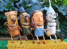 three cartoon figures are standing in front of some plants