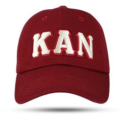 a red hat with the word kan embroidered on it's front and side panels