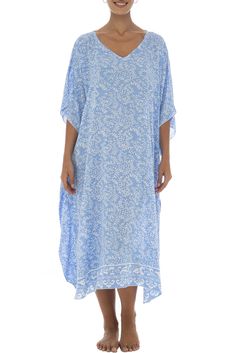 Soft as a daydream, this flowing poncho style black dress sweetens your summer downtime with its light flowing fabric and pastel buttermint hues. Handmade design features a pretty batik floral print, as well as butterfly sleeves that mirror the easy mid-calf hemline. Generously sized to provide ample coverage for womens regular to plus sizes; wear as a beach caftan, lounge dress or maxi cover up for swimwear. Back From Bali is dedicated to creating beautiful, quality clothing with a heart. All o