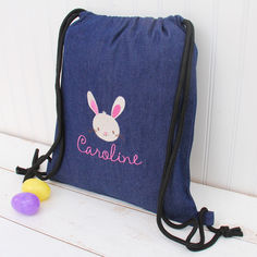 a drawsack bag with an embroidered bunny on it