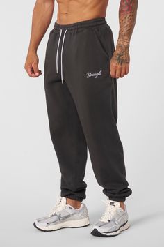 MATERIAL: 100% Cotton. 360 GSM FIT: Loose. DESIGN: The For Him joggers offer the ideal blend of comfort and style for the cooler fall and winter months. Featuring a loose fit that allows for easy movement, these joggers keep you cozy whether you're lounging or on the go. The simple embroidered logo adds a touch of branding while maintaining a clean and minimalistic look. MODEL: The model in the first photo is wearing a size Medium. Weight: 175lb Height: 5'9 Sporty Cotton Sweatpants For Streetwear, Urban Style Sweats For Streetwear With Elastic Waistband, Urban Sweats With Elastic Waistband For Streetwear, Sporty Streetwear Sweats With Elastic Waistband, Sporty Sweats For Streetwear With Elastic Waistband, Athleisure Sweatpants For Streetwear With Relaxed Fit, Athleisure Sweatpants With Elastic Waistband For Streetwear, Athleisure Sweatpants With Ribbed Waistband For Streetwear, Athleisure Sweats With Elastic Waistband For Streetwear