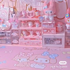 there are many hello kitty toys on the shelf in this room, and it's so cute