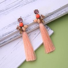 Bohemian Floral Long Tassel Pink Drop Earrings Elevate your style with these exquisite classic pink long tassel Bohemia flower drop earrings. Designed to add a unique touch to any look, these earrings are a must-have for fashion enthusiasts. Stunning Design The tassel design brings a dramatic flair to any ensemble, making these earrings perfect for both casual outings and special occasions. Stand out and showcase your individuality with this eye-catching accessory. Quality Materials Item Type: F Earring Photo, Pink Drop Earrings, Prom Necklaces, Hummingbird Earrings, Tassel Earring, Tassels Fashion, Pink Tassel, Party Necklace, Bohemian Floral