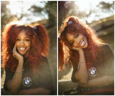 a woman with red hair smiling and posing for the camera