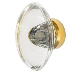 a glass door knob with gold accents