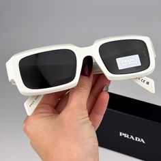 Prada Pr27zs 17k08z Sunglasses Talc White Dark Grey Unisex Rectangle Pr 27zs Brand New And 100% Authentic! Made In Italy. Same/Next Day Shipping! Brand: Prada Model Number: Pr27zs / Pr 27zs Color Code: 17k08z Gender: Unisex Year: 2023 Frame Shape: Rectangle Frame Color: Talc White Frame Material: Acetate Frame Type: Full Rim Lens Color: Dark Grey Lens Material: Polyamide Bio Lens Protection: Category 3 Size: 54x21x145 100% Uv Protection Full Retail Prada Set Includes: 1. Glasses 2. Case 3. Clean Modern White Rectangular Sunglasses, Designer White Sunglasses For Formal Occasions, Prada Model, Rectangle Frame, Color Code, Cleaning Cloth, White Frame, Uv Protection, Sunglasses Accessories