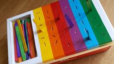 there are many different colored pencils in the box