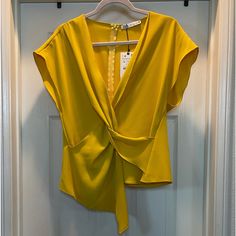 Cheerful Sophisticated Short Sleeved Blouse With Modern Accented Front Twist, With Classic Zipper On Back Of Blouse. Elegant V-neck Top For Day Out, Chic Sleeveless Blouse For Office, Chic Sleeveless Office Blouse, Elegant Yellow V-neck Top, Chic Summer Office Tops, Elegant Yellow V-neck Blouse, Sleeveless Blouse For Office In Spring, Chic Formal Sleeveless Blouse Top, Elegant Sleeveless Blouse For Day Out