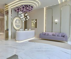 the interior of a luxury hotel lobby with marble floors and purple couches, chandeliers and mirrors