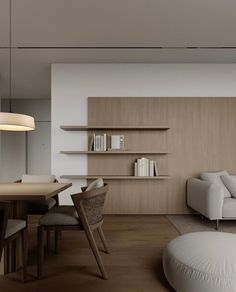 a living room filled with furniture next to a table and bookshelf on top of a hard wood floor