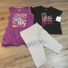 Purple Tank Top Dress Like Shirt Is Brand Extremely Me!, Size 5/6, Is Cinched At Sleeves With Fabric Band And At Bottom Hem With Elastic. Top Is In Euc. Black Shirt Is Jumping Beans Active, Size 5t, And Nwt. Silver Sparkle Shorts Are Bermuda (Knee) Length, Cartwheel Style, And Are 365 Kids Brand And A Size 5. Cute Short Sleeve Purple Set, Playful Stretch Black Tops, Playful Black Stretch Top, Stretch Black Tops For Playwear, Black Stretch Tops For Playwear, Black Playful Stretch Top, Playful Fitted Purple Tops, Purple Tops For Playtime In Summer, Purple Tops For Summer Playtime