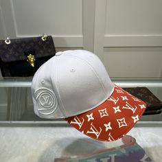 SHOP MORE LUXURY PRODUCTS HERE Description Louis Vuitton Match Cap White/Red LV Cap M77743 Luxurious textures and iconic House emblems characterize this LV Match cap. This sporty piece is finished with a Monogram Jacquard visor, an embroidered composition of a tennis ball with the LV Circle at the side and a strap at the back. The style is part of a new collection inspired by the world’s four historic tennis tournaments. White/RedJacquard weaveMonogram patternTennis ball with LV Circle emb Designer White Visor Baseball Cap, Designer White Snapback Hat, Designer Baseball Cap With Embroidered Logo, Designer Embroidered Logo Baseball Cap, Luxury White Baseball Cap, Luxury White Snapback Hat, Luxury White Visor Hat, Designer White Visor Hat, Designer White Hat With Curved Brim