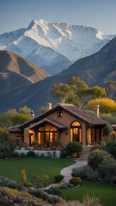 a house with mountains in the background