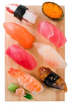 assorted sushi on a wooden cutting board stock photo getty images black bedroom furniture sets home design ideas