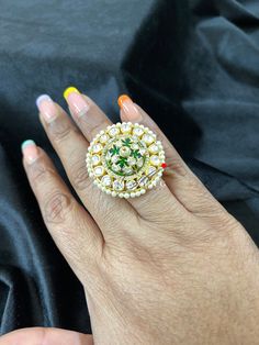 Indian Wedding Ring | Moissanite Ring| Indian Traditional Ring| Polki Ring|Moissanite Polki Ring | Indian Polki | Statement Ring | Ring | Material : Silver Gemstone: Moissanite, Swarovski Stones and Green Enamel Stone colour: Uncut Polki Primary colour: Gold Ring Size : Adjustable Silver Intricate, hand crafted, Pure Silver Polki Rings , studded with high quality Moissanite Polki , made in 92.5 silver with 22ct gold plating. Product comes with 92.5 silver hallmark. - We also Customize ring size Hand Set Green Rings For Wedding, Hand-set Green Rings For Wedding, Green Hand-set Wedding Rings, Hand-set Green Wedding Rings, Green Diamond Ring Hand Set For Anniversary, Gold Multi-stone Emerald Ring For Weddings, Gold Multi-stone Emerald Wedding Ring, Fusion Style Green Rings With Accent Stones, Hand-set Green Diamond Ring