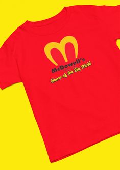 a red t - shirt that says mcdonald's home of the big macs