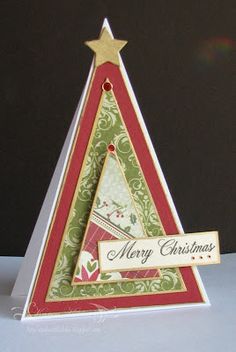 a christmas card with a tree made out of paper and a merry message on it