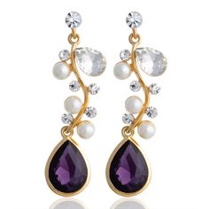 PRICES MAY VARY. CAPTIVATING FIRST LOOK: Our gold chandelier teardrop earrings dazzle with sleek lines, adorned with pearls and rhinestones, culminating in a striking purple teardrop acrylic stone. These earrings symbolize sophisticated craftsmanship and are perfect for both formal events and adding elegance to everyday wear. ROYAL PURPLE GEM: The majestic purple gemstone of these earrings captures the essence of royal elegance, making them an ideal statement piece. Whether it's wedding earrings Sophisticated Fashion, Purple Gems, Stone Dangle Earrings, Daily Jewelry, Gold Chandelier, Colored Gems, Royal Purple, Classic Gold, Stylish Gifts