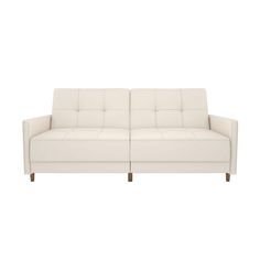 a white couch sitting on top of a white floor