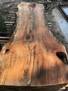 a large piece of wood with writing on it