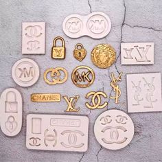 many different types of metal and plastic objects on the ground, including letters and symbols