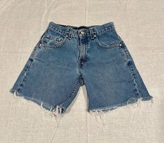 Vintage 90s Levi Silvertab Baggy women's cutoff jean shorts. Tag indicates size 10 regular, but please read measurements below as they are smaller than a traditional women's size 10. Button & zipper closure. Light/medium wash denim, 100% cotton so they do not stretch.  Waist: 12" Across Laid Flat Rise: 10" Hips: Approx. 17.5" Laid Flat Inseam: 6"   Sold AS-IS. Cutoff Jeans, Cutoff Jean Shorts, Short En Jean, Cut Off Shorts, Waist Size, Jeans Shorts, Cut Off, Vintage 90s, Short Outfits