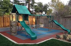 a play area with a slide and climbing frame