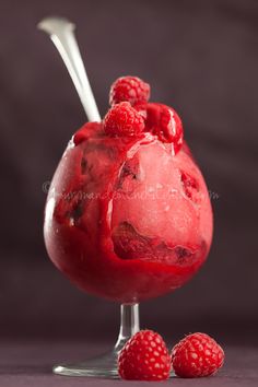 raspberry sorbet with ice cream and berries on the rim, ready to be eaten