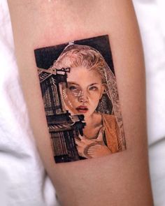 a woman's arm with a portrait on it