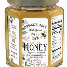 a jar of raw honey with labels on it