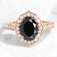 Large oval black diamond engagement ring rose gold vintage halo black diamond ring la more design jewelry Black Diamond Engagement Ring Vintage, Black Diamond Halo Ring, Rose Gold Oval Engagement Ring, Oval Halo Ring, Black Diamond Wedding Bands, Wedding Ring Shapes, Black Diamond Engagement Ring, Rose Gold Diamond Ring Engagement, Vintage Halo